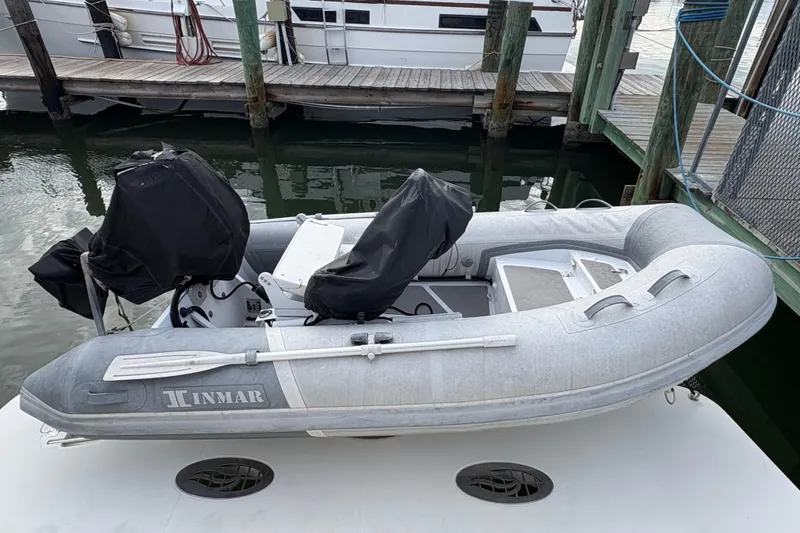 Slide: The Image of Inflatable dinghy on a 2004 Carver 560 Voyager yacht, docked at a marina. - 29