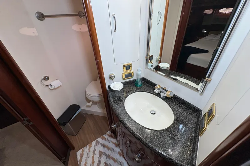 Slide: The Image of Luxurious bathroom in 2004 Carver 560 Voyager yacht with elegant sink and modern fixtures. - 52