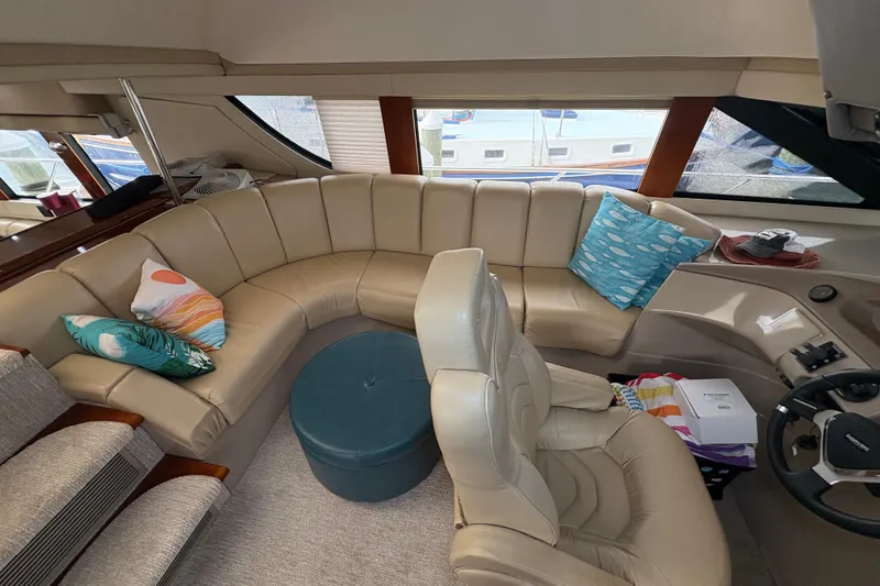 Slide: The Image of Luxurious interior of 2004 Carver 560 Voyager yacht with plush seating and colorful cushions. - 59