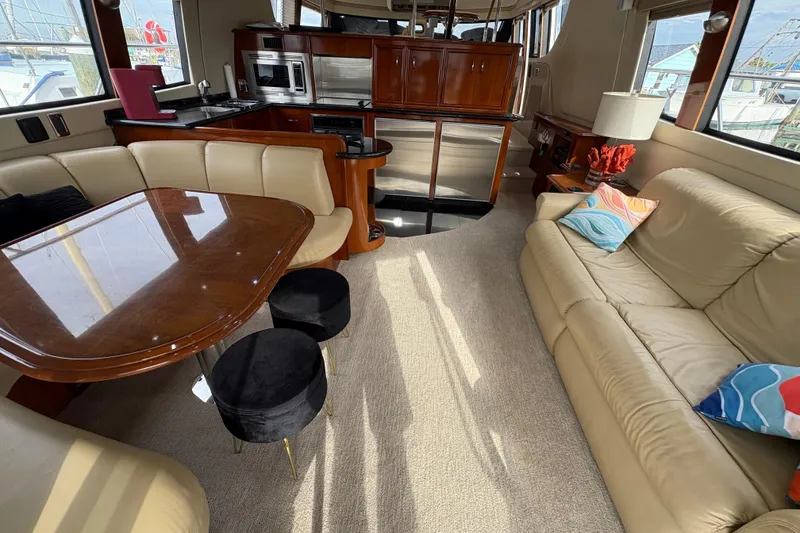 Slide: The Image of Luxurious interior of a 2004 Carver 560 Voyager yacht with elegant seating and modern kitchen. - 75