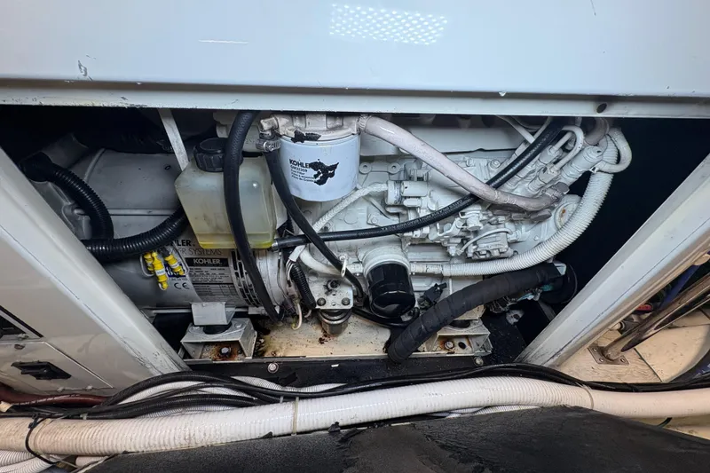Slide: The Image of Engine compartment of a 2004 Carver 560 Voyager yacht, featuring Kohler power systems. - 91