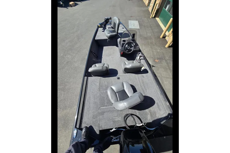 Slide: The Image of 2024 Tracker Bass Tracker Classic XL boat with gray seating and steering console. - 4