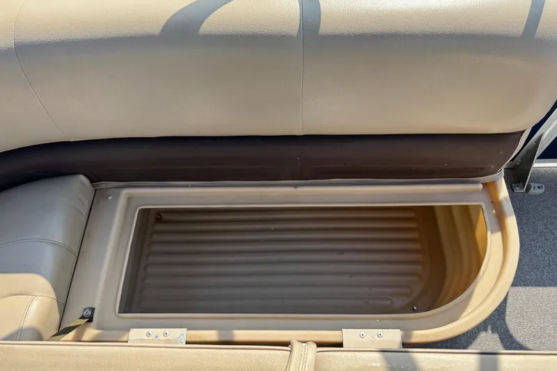 Slide: The Image of Storage compartment in a 2019 Sun Tracker Party Barge 18 DLX pontoon boat. - 16