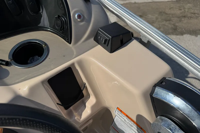 Slide: The Image of 2019 Sun Tracker Party Barge 18 DLX console with cup holder and control panel. - 20