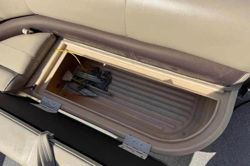 Slide: The Image of Storage compartment in a 2019 Sun Tracker Party Barge 18 DLX with anchor and chain. - 7