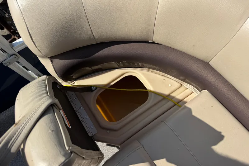 Slide: The Image of 2019 Sun Tracker Party Barge 18 DLX seat storage compartment with open lid. - 8