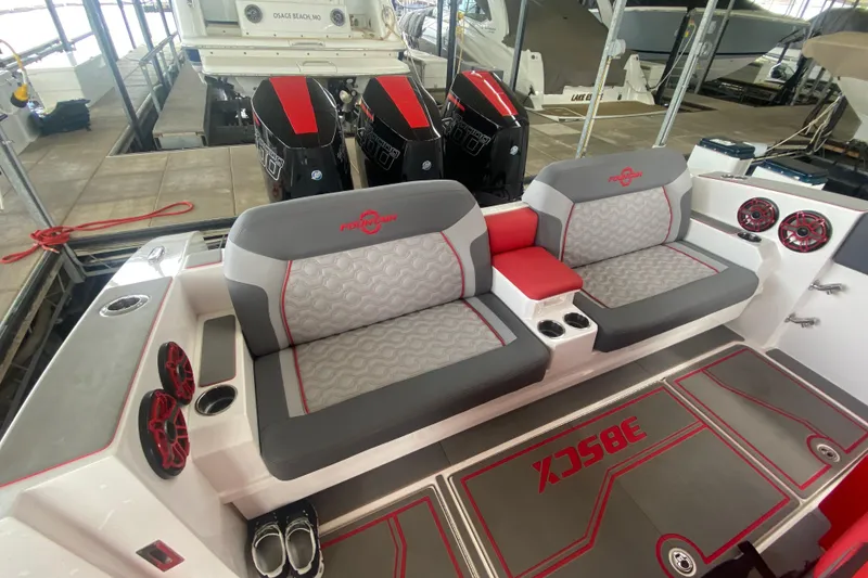 Slide: The Image of 2025 Fountain 38 SCX boat interior with stylish seating and powerful outboard engines. - 13