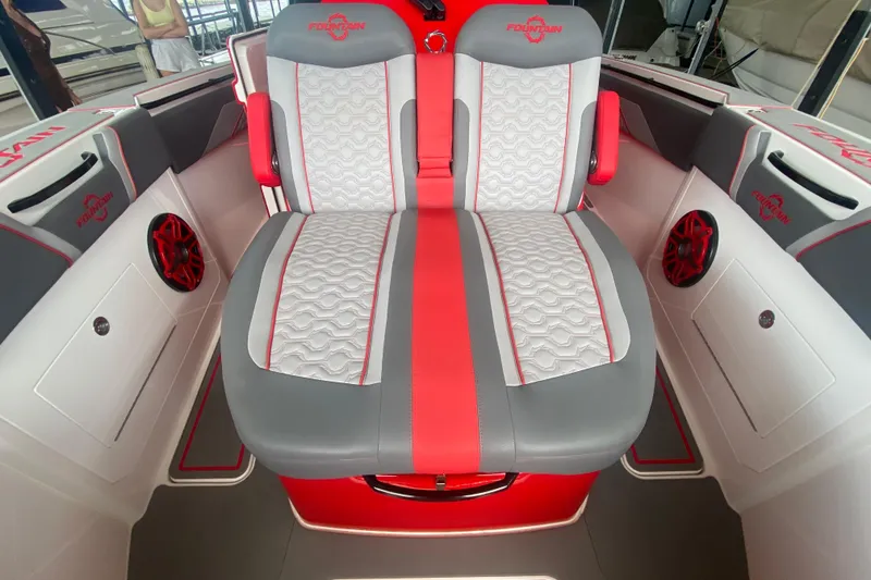 Slide: The Image of Luxury seating on 2025 Fountain 38 SCX boat with red and gray accents. - 24