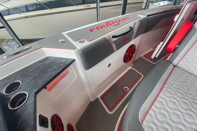 Slide: The Image of 2025 Fountain 38 SCX boat interior with sleek design, red accents, and modern features. - 26