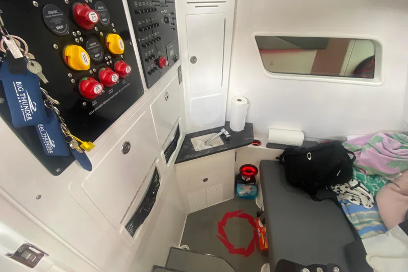 Slide: The Image of Interior of a 2025 Fountain 38 SCX boat with control panel and seating area. - 28