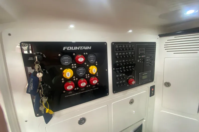 Slide: The Image of Control panel of 2025 Fountain 38 SCX boat with keys and switches. - 30