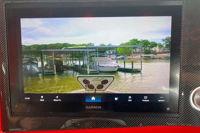 Slide: The Image of Garmin display on 2025 Fountain 38 SCX boat, showing marina view with docked boats. - 33