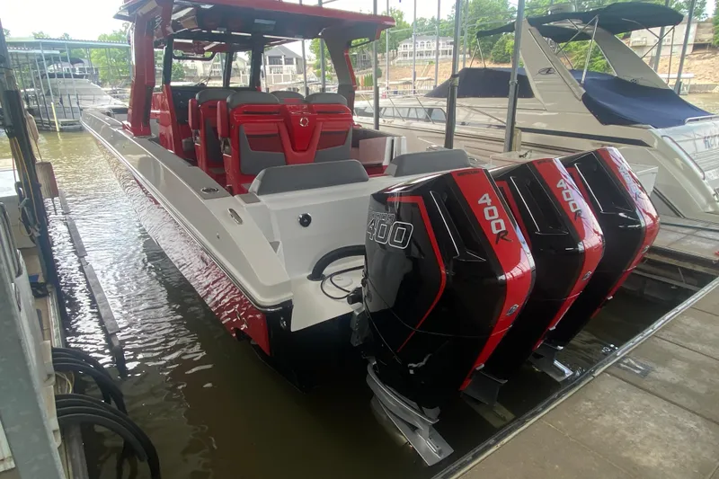 Slide: The Image of 2025 Fountain 38 SCX boat with triple 400R Mercury engines docked at marina. - 9