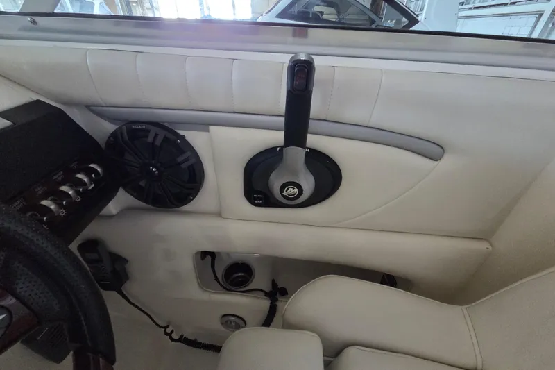 Slide: The Image of Interior of a 2005 Sea Ray 270 SLX boat showing controls and speaker system. - 20