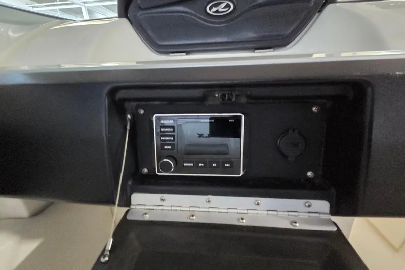 Slide: The Image of Dashboard of a 2005 Sea Ray 270 SLX boat featuring a modern audio system. - 21