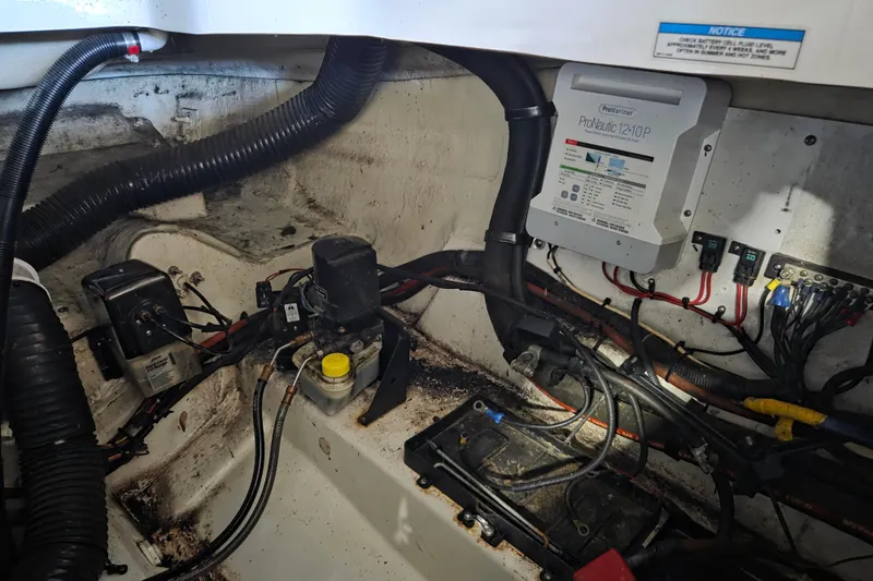 Slide: The Image of Engine compartment of a 2005 Sea Ray 270 SLX with wiring and ProNautic charger. - 23