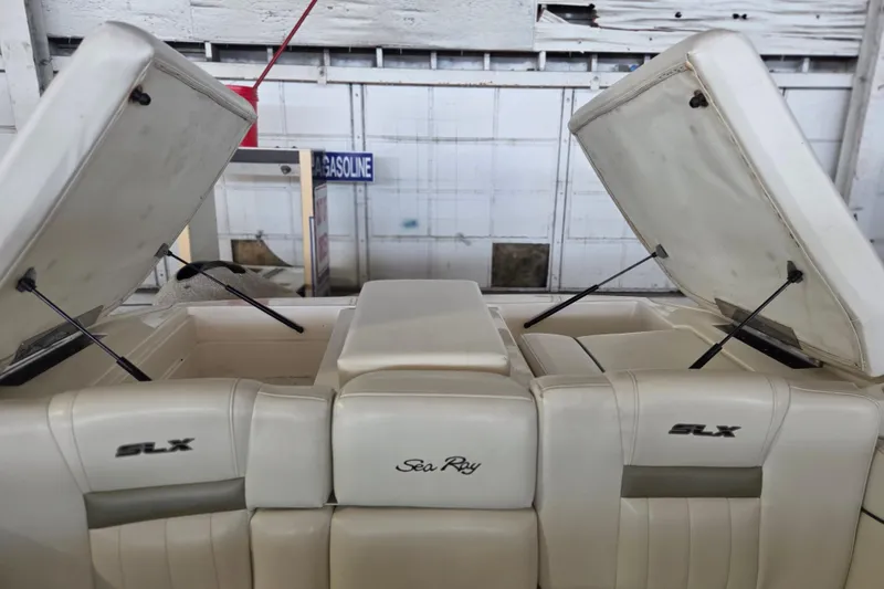 Slide: The Image of 2005 Sea Ray 270 SLX boat interior with open storage compartments. - 25