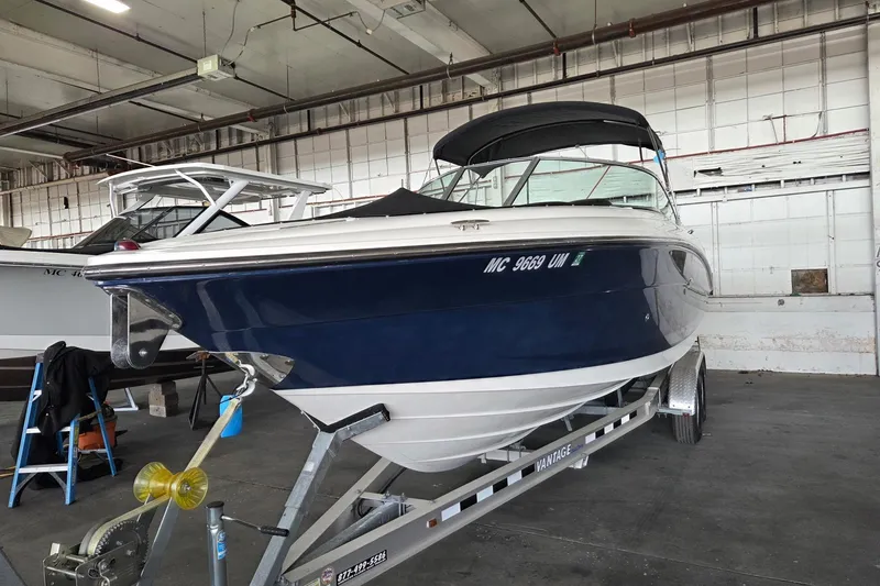 Slide: The Image of 2005 Sea Ray 270 SLX boat on trailer in indoor storage facility. - 3