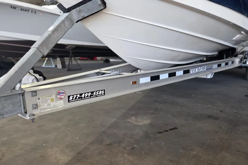 Slide: The Image of 2005 Sea Ray 270 SLX boat on Vantage trailer in a garage setting. - 32