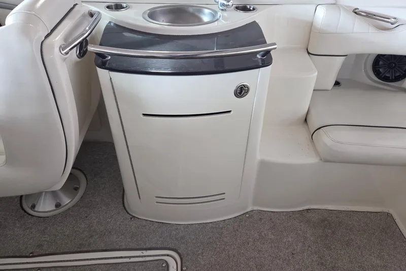 Slide: The Image of Interior of 2005 Sea Ray 270 SLX boat with sink and seating area. - 7