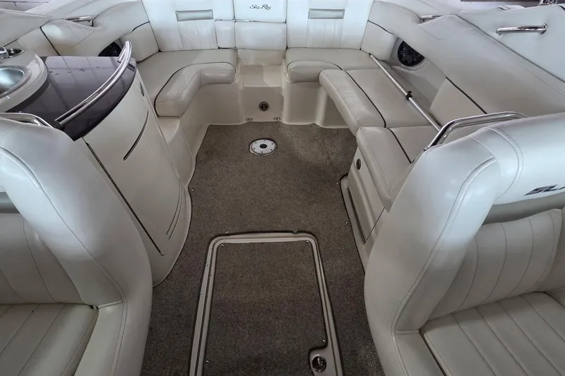 Slide: The Image of Interior of a 2005 Sea Ray 270 SLX boat with luxurious white seating. - 8