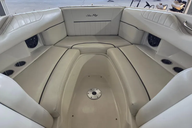 Slide: The Image of Interior of a 2005 Sea Ray 270 SLX boat with white leather seating. - 9