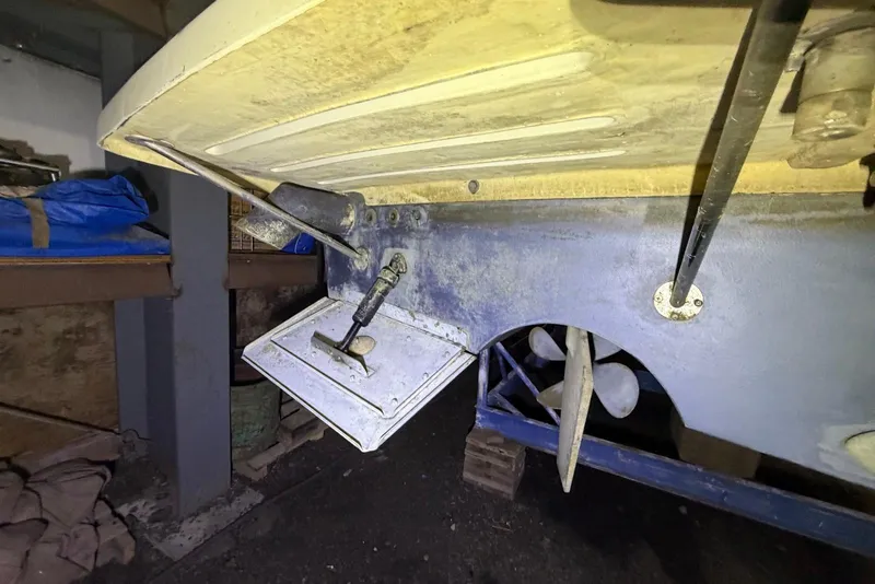 Slide: The Image of 2005 Mainship Pilot 34 boat underside showing propeller and trim tab details. - 47