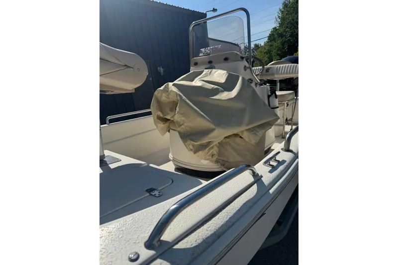 Slide: The Image of 2016 Carolina Skiff 18 JVX CC boat interior with covered console and seating. - 10