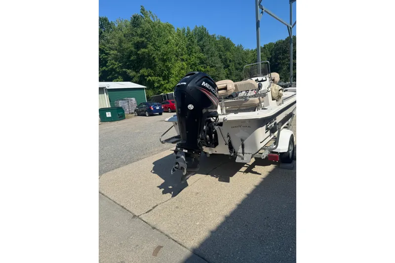 Slide: The Image of 2016 Carolina Skiff 18 JVX CC boat with Mercury outboard motor on trailer. - 3