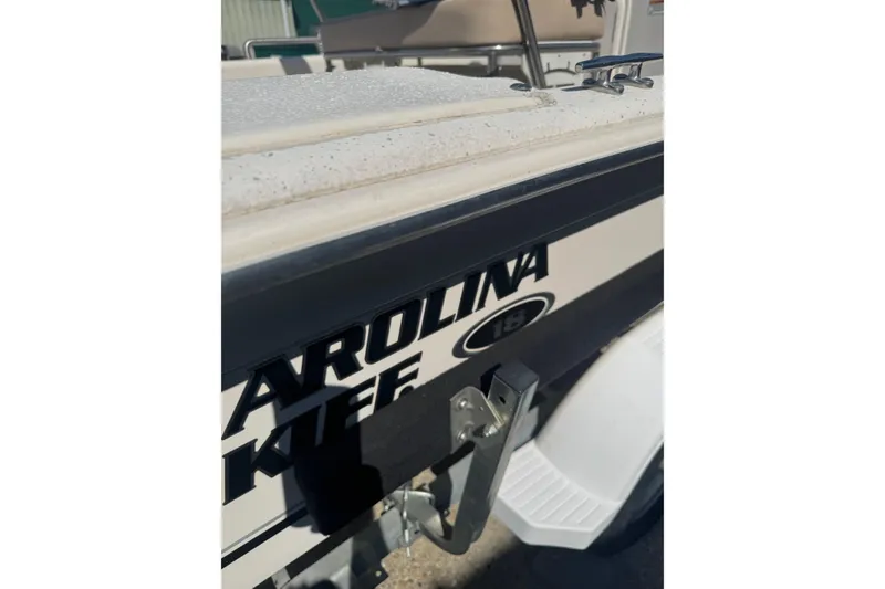 Slide: The Image of 2016 Carolina Skiff 18 JVX CC boat side view with logo detail. - 4