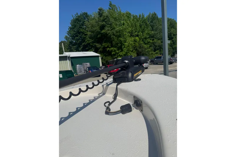 Slide: The Image of 2016 Carolina Skiff 18 JVX CC boat with trolling motor, parked outdoors. - 6