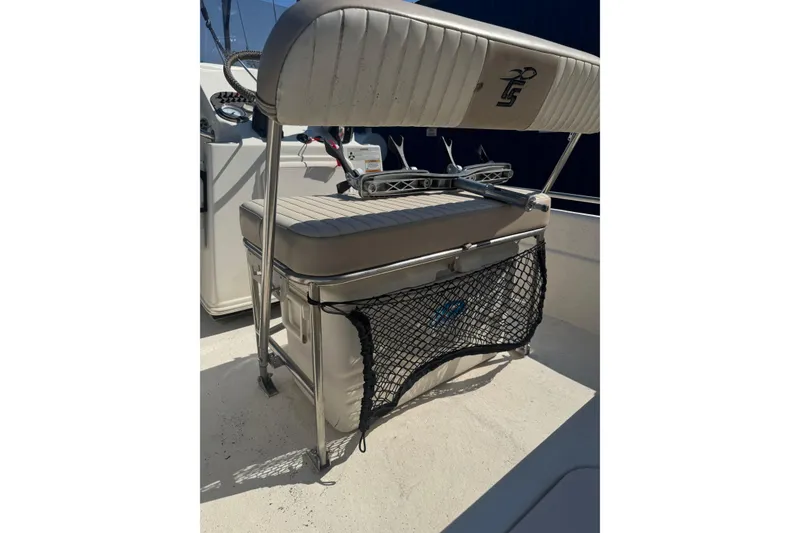 Slide: The Image of 2016 Carolina Skiff 18 JVX CC boat seat with storage net and console view. - 8