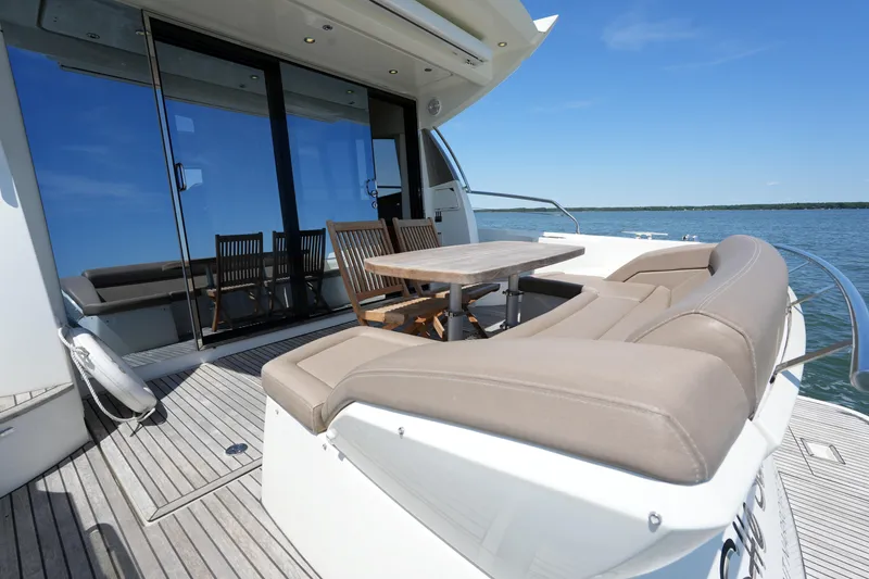 Slide: The Image of Luxurious 2015 Prestige 500S yacht deck with seating and ocean view. - 14