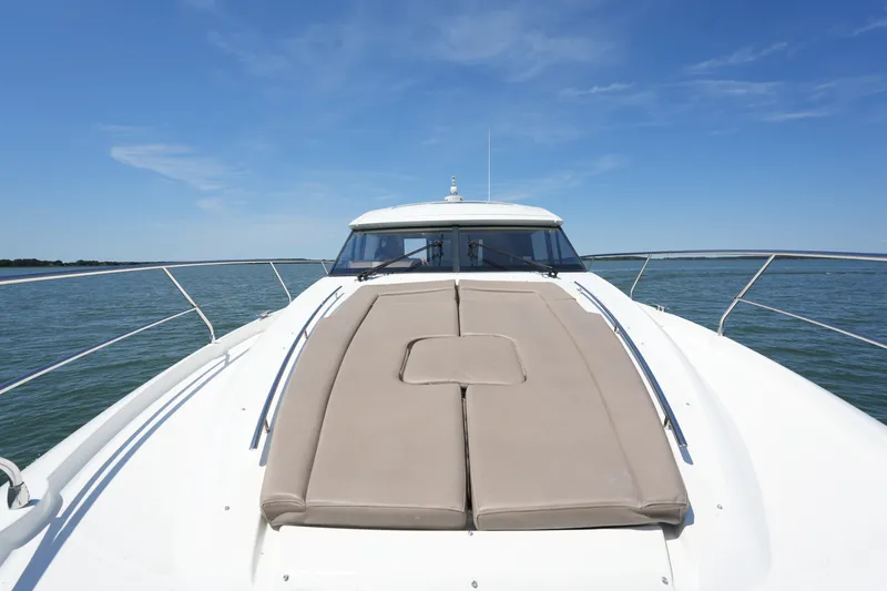 Slide: The Image of 2015 Prestige 500S yacht deck with sunpad, cruising on calm waters under clear blue sky. - 21