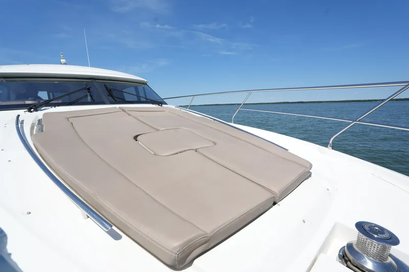 Slide: The Image of Prestige 500S 2015 yacht with sunpad, cruising on calm waters under clear blue sky. - 22
