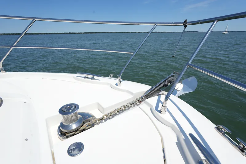 Slide: The Image of Bow of 2015 Prestige 500S yacht with anchor chain, on calm water. - 23