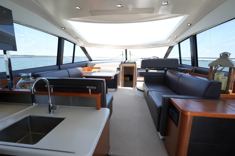 Slide: The Image of Luxurious interior of a 2015 Prestige 500S yacht with modern furnishings and panoramic windows. - 27