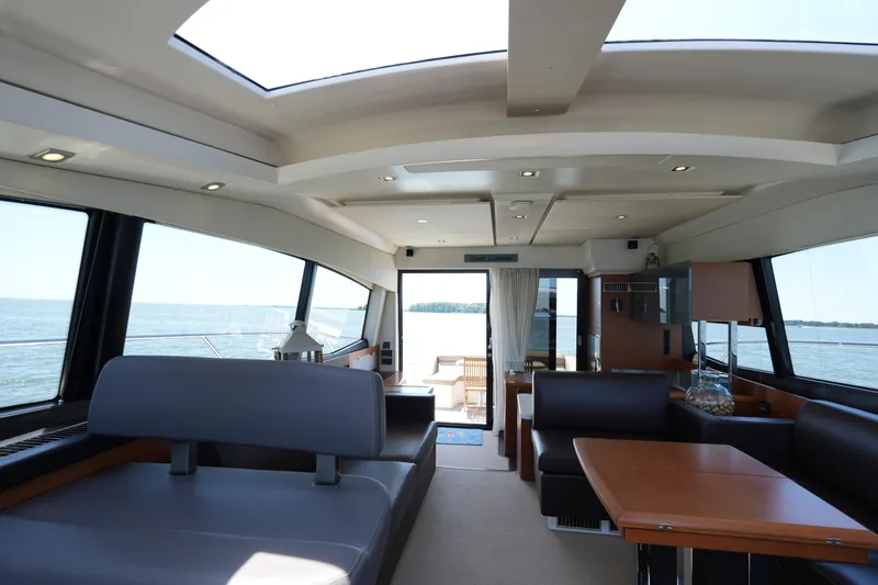 Slide: The Image of Luxurious interior of 2015 Prestige 500S yacht with panoramic windows and elegant seating. - 28
