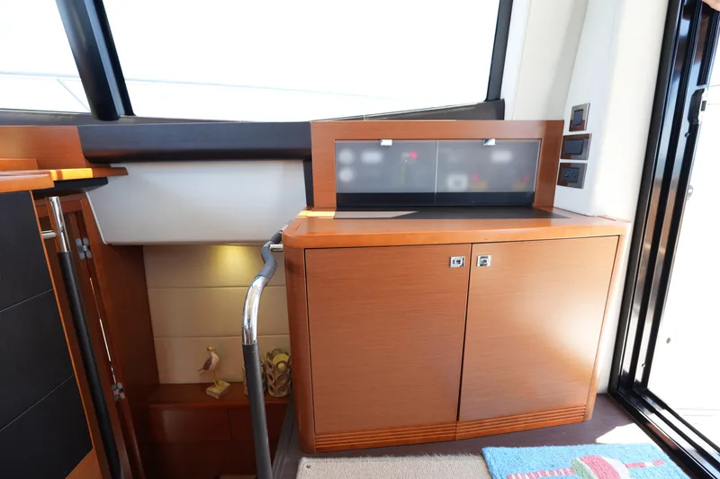 Slide: The Image of Interior of 2015 Prestige 500S yacht with wooden cabinetry and modern design elements. - 35