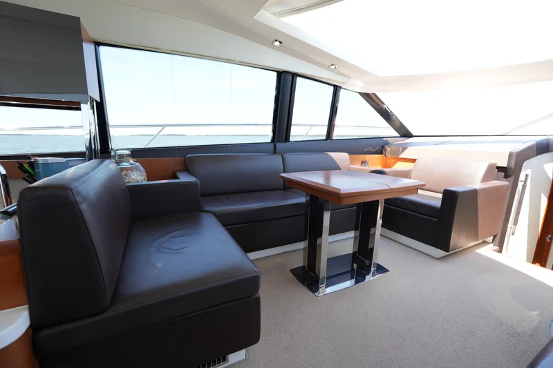Slide: The Image of Luxurious interior of a 2015 Prestige 500S yacht with modern seating and table. - 39