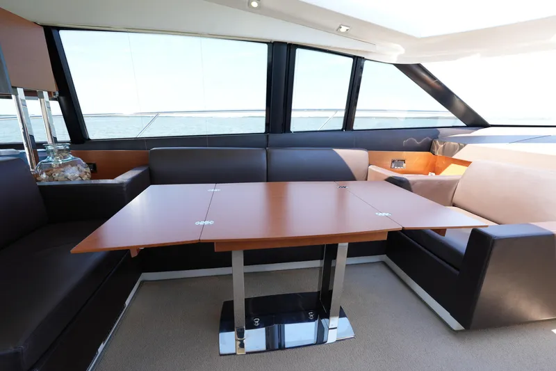 Slide: The Image of Luxurious interior of 2015 Prestige 500S yacht with elegant seating and wooden table. - 41