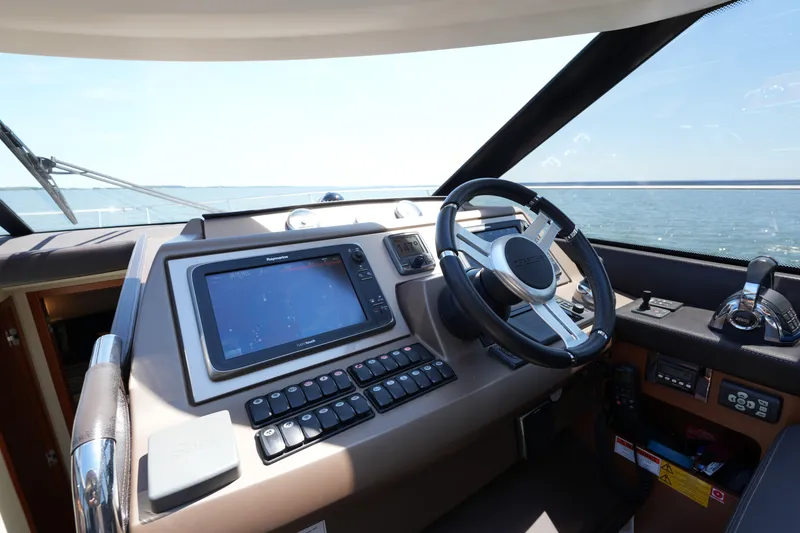Slide: The Image of Cockpit of 2015 Prestige 500S yacht with steering wheel and navigation system. - 46