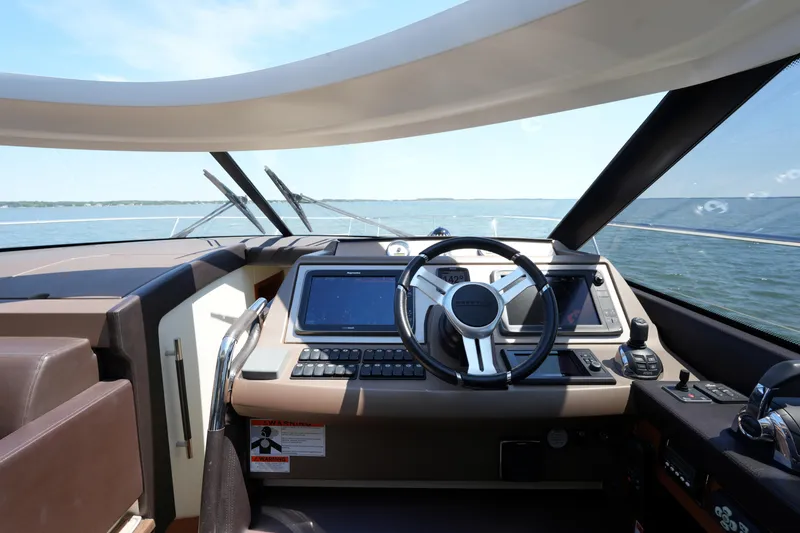 Slide: The Image of Cockpit of 2015 Prestige 500S yacht with modern navigation equipment and steering wheel. - 47