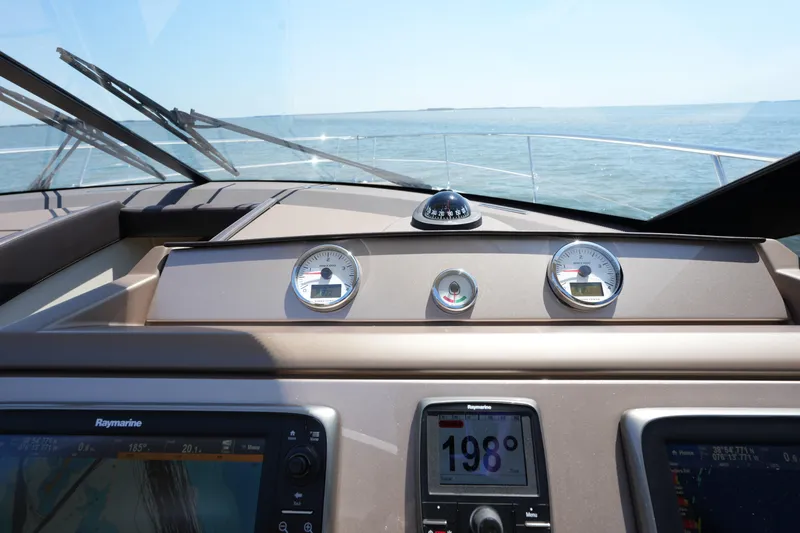 Slide: The Image of Dashboard view of a 2015 Prestige 500S yacht navigating open waters. - 49
