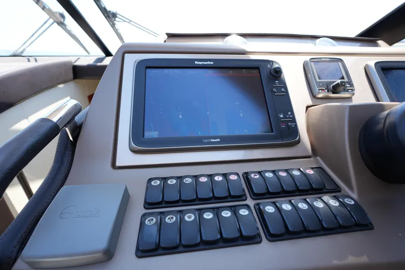 Slide: The Image of Control panel of a 2015 Prestige 500S yacht featuring navigation and control systems. - 50