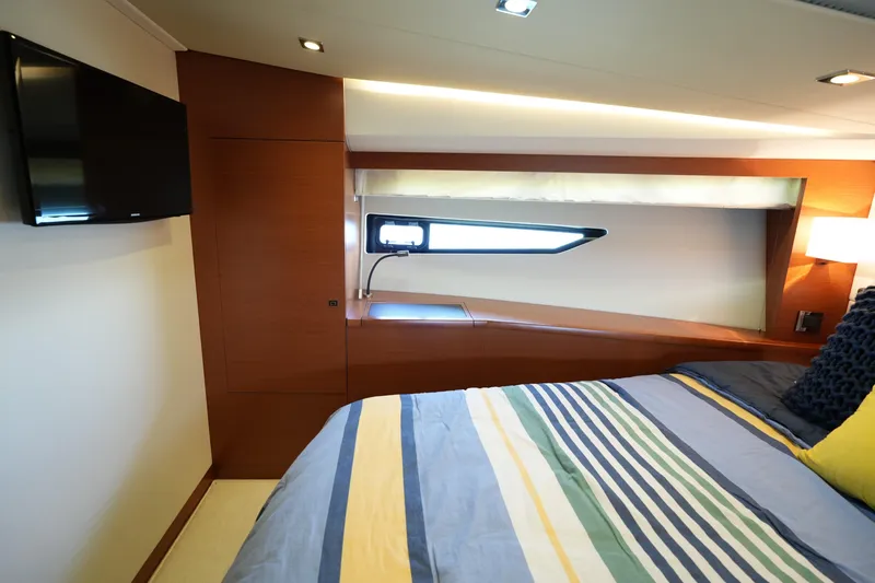 Slide: The Image of Luxurious cabin interior of 2015 Prestige 500S yacht with modern decor and window view. - 55