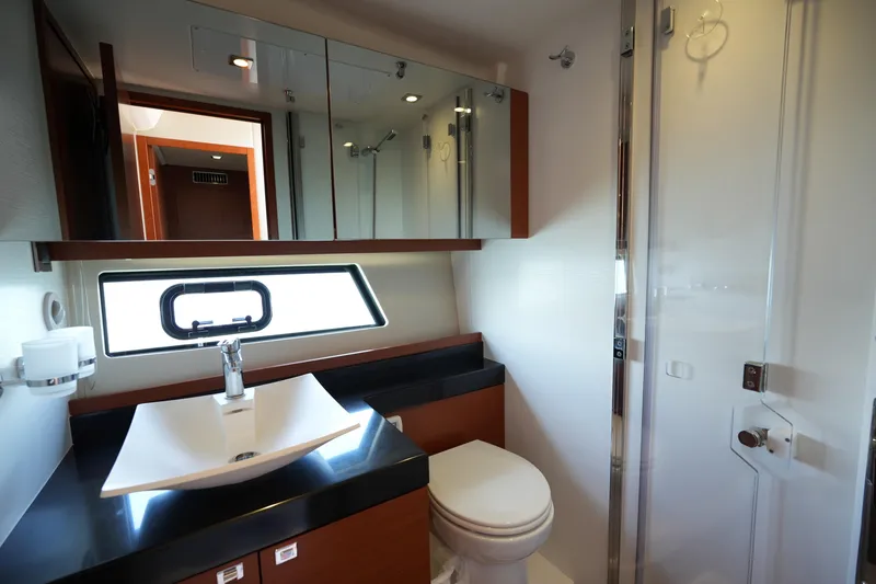 Slide: The Image of Luxurious bathroom interior of 2015 Prestige 500S yacht, featuring modern sink and sleek design. - 59