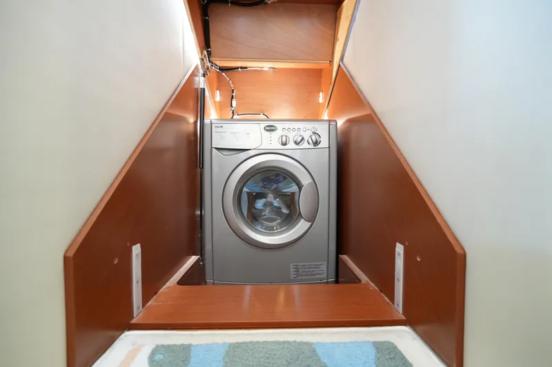 Slide: The Image of Compact washing machine in a 2015 Prestige 500S yacht interior space. - 64