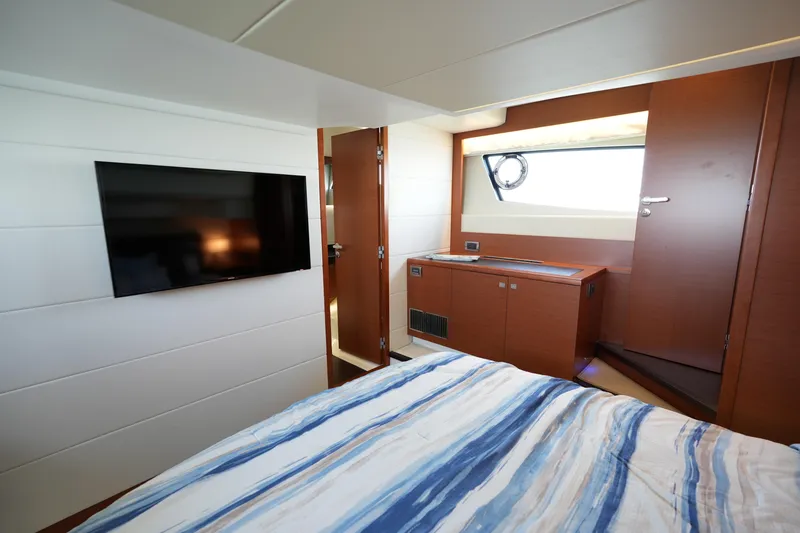 Slide: The Image of Luxurious cabin interior of 2015 Prestige 500S yacht with TV and window view. - 70