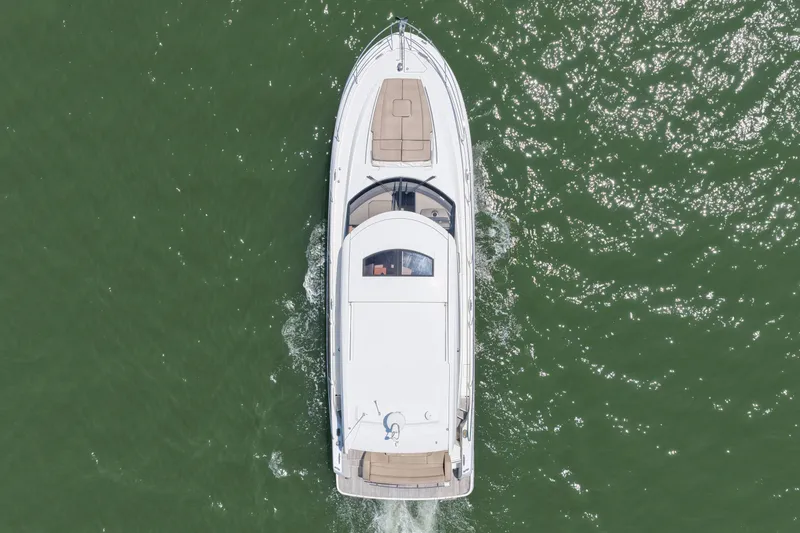 Slide: The Image of Aerial view of 2015 Prestige 500S yacht cruising on green water. - 8